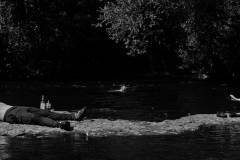 man-lays-on-rocks-shouted-at-by-woman-BnW