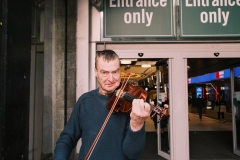 Violin-player-stares-at-camera-Arndale