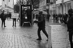 street-preachers-argue-one-looks-towards-camera-BnW