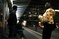 Piccadilly-tram-stop-girl-gazes-at-sign-1-EDIT-COLOUR