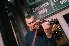 Violin-player-stares-at-floor-Arndale