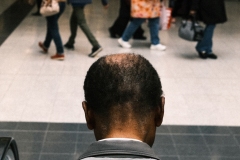 man-on-escalator-back-of-head-colour