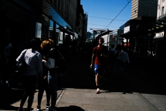 man-strides-from-shadow-outside-primark